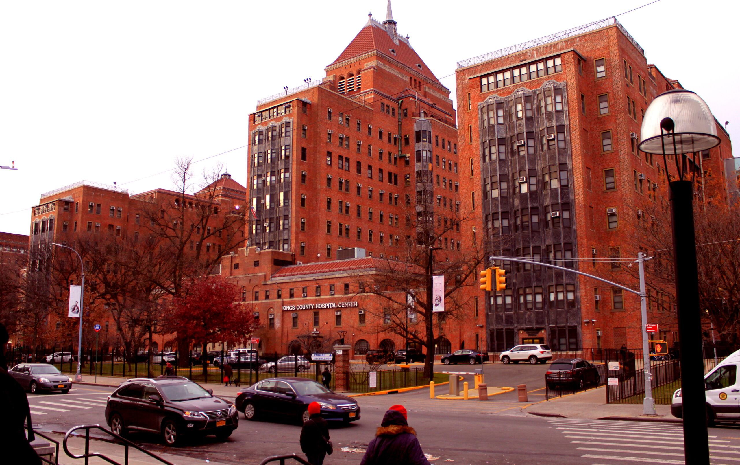 Brownstone hospital street view with 'Kings County Hospital Center' written in white letters on the front of the building